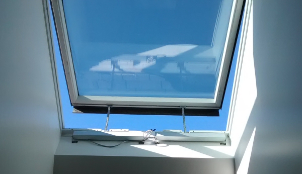 automated remote control of skylight and window openers with rain sensing